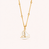 Naut & Chain The Mariner Necklace featuring a sleek silver chain with a nautical-inspired pendant, styled on a model.