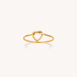Gold Heart Knot Ring by Naut & Chain, close-up of the elegant jewelry piece with a heart-shaped knot design.