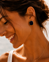 Naut & Chain Midnight Cove Stud Earrings featuring small, silver-toned earrings with a sleek, modern design.