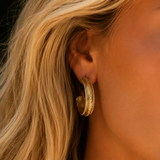 Naut & Chain Bella Hoops earrings featuring sleek, gold-toned hoop design with polished finish, displayed against a neutral background.