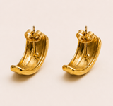 Naut & Chain Capri earrings featuring elegant gold hoops with intricate detailing, displayed against a neutral background.
