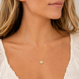 Naut & Chain Cove Diamond Circle Necklace worn by a model, featuring a delicate chain with a sparkling diamond circle pendant.