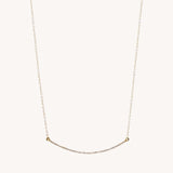 Gold diamond bar necklace called The Angela by Naut & Chain, featuring a sleek pendant on a delicate chain.
