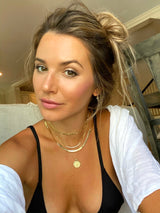 14K gold herringbone chain from Naut & Chain, close-up of the sleek, woven design on a plain background.